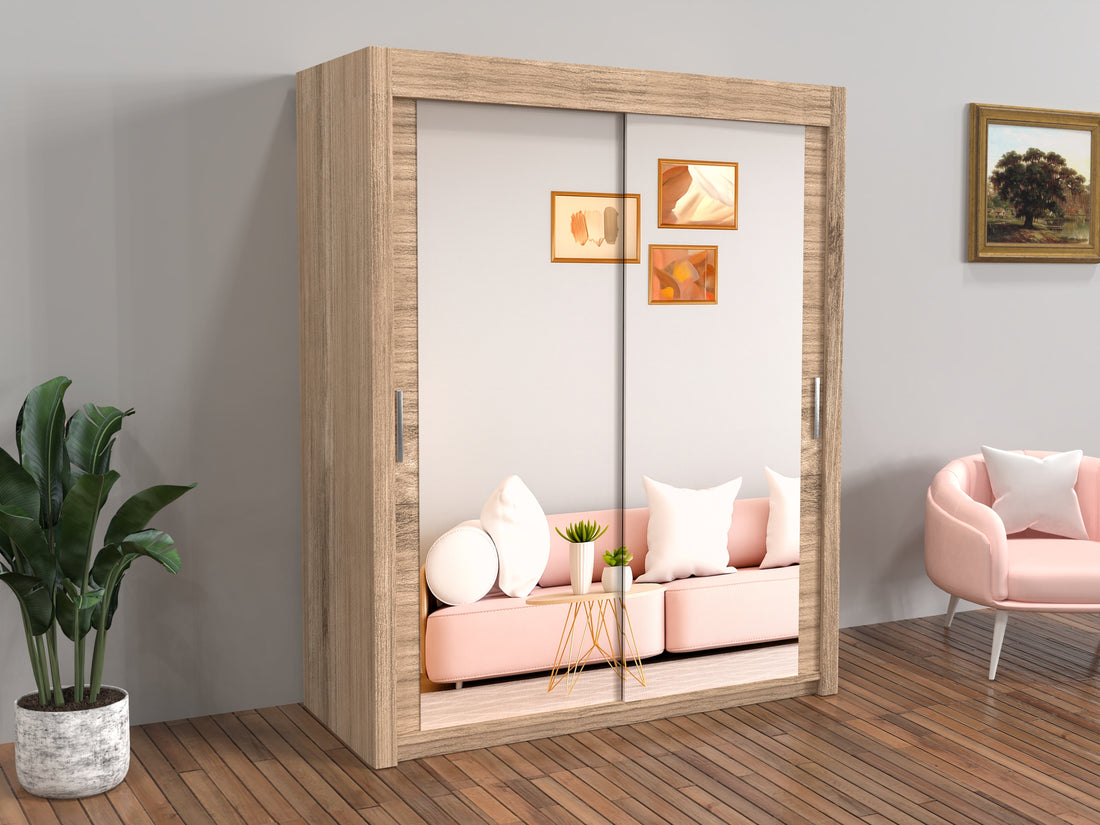 Wooden wardrobe with sliding doors displaying a pink bedroom scene, plant, and chair in the room.